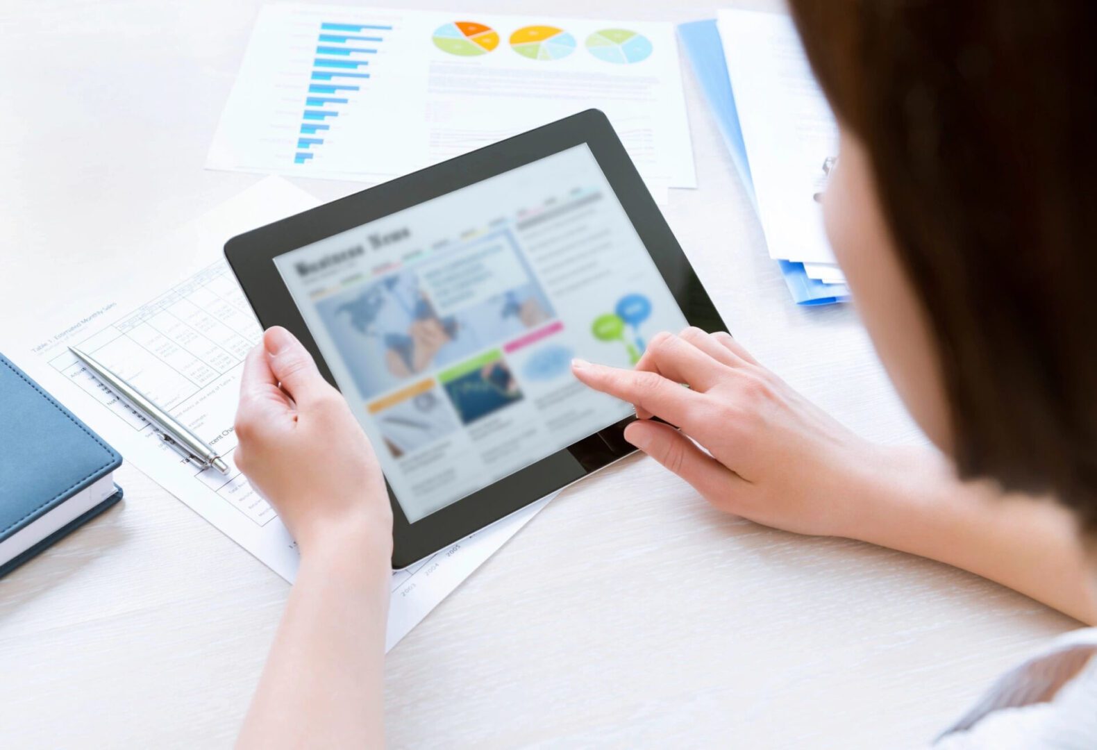 girl looking at news using a tablet